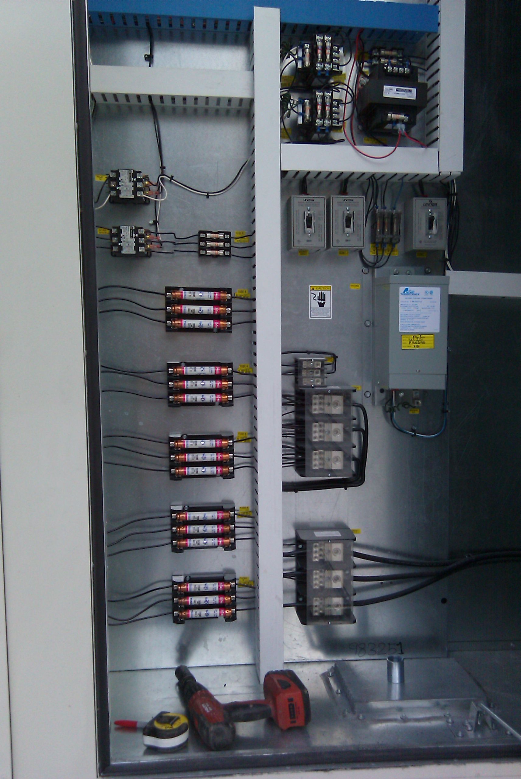 a close up of a electrical panel with a lot of wires