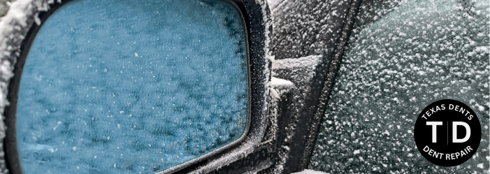 image of icy rear view mirror on frozen car in texas