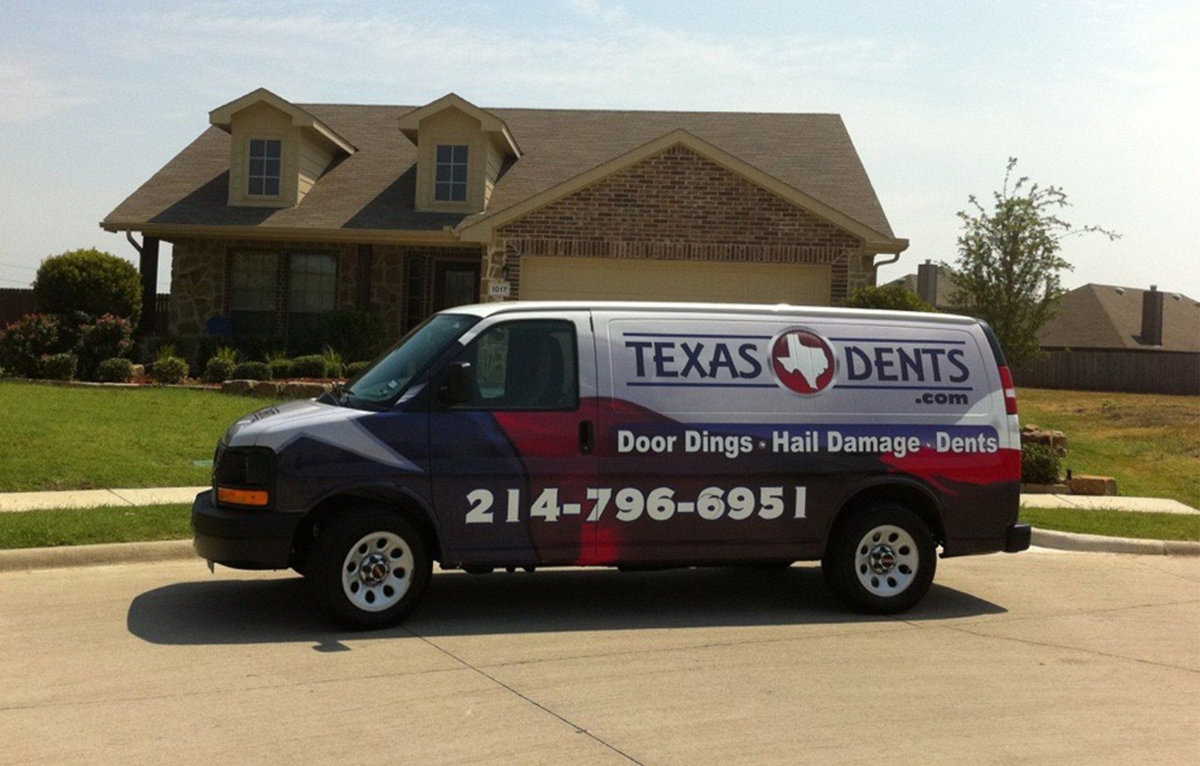 a texas dents van is parked in front of a house