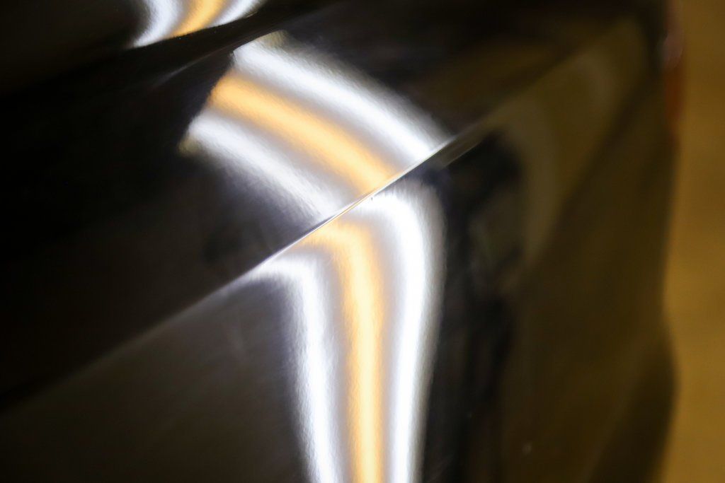 a close up of a car with a light coming out of it .