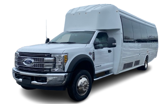 White shuttle bus with large windows, a raised roof, and a Ford Super Duty truck chassis.