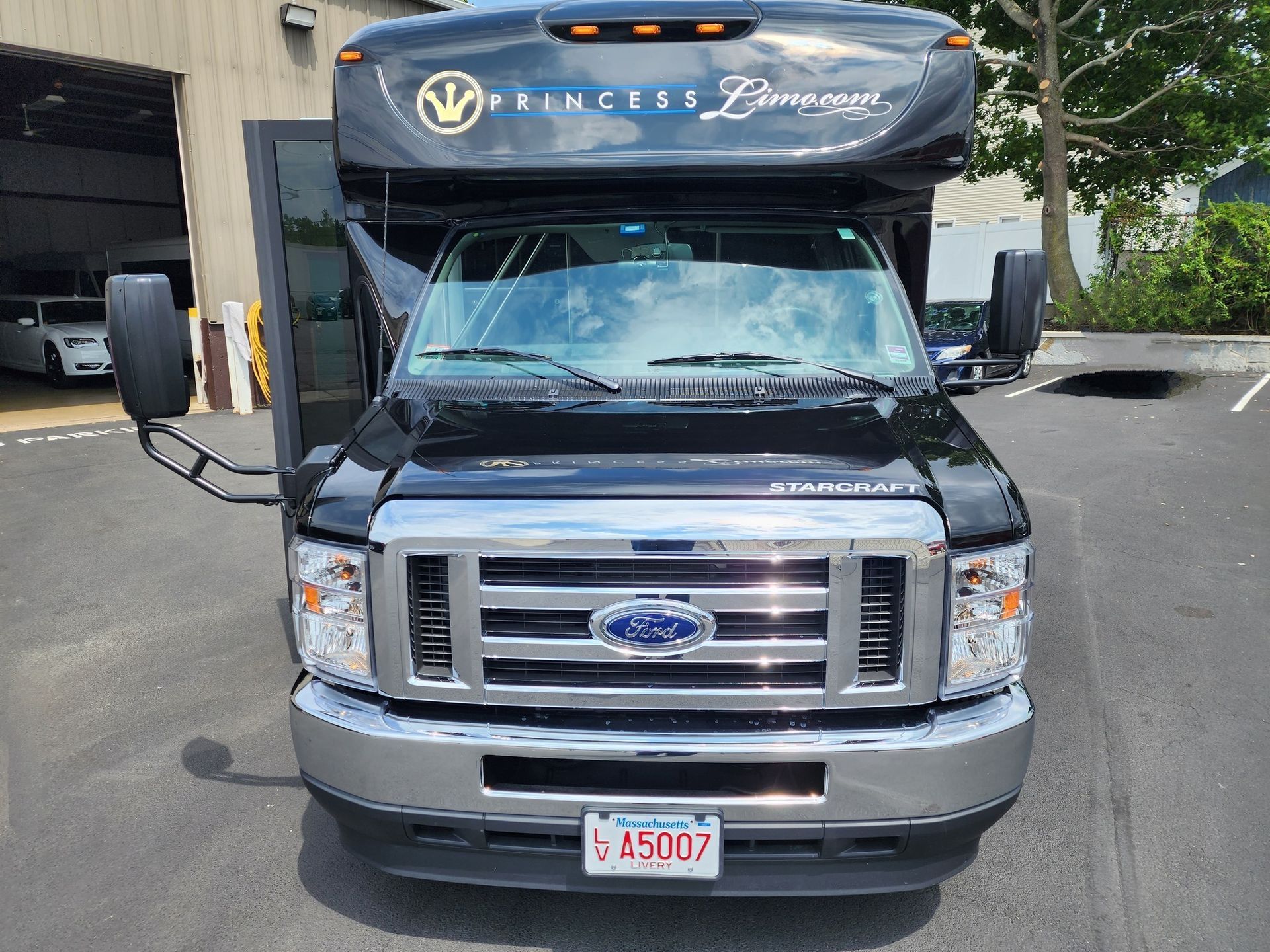 Black Princess Limousine van parked with door open; license plate visible.