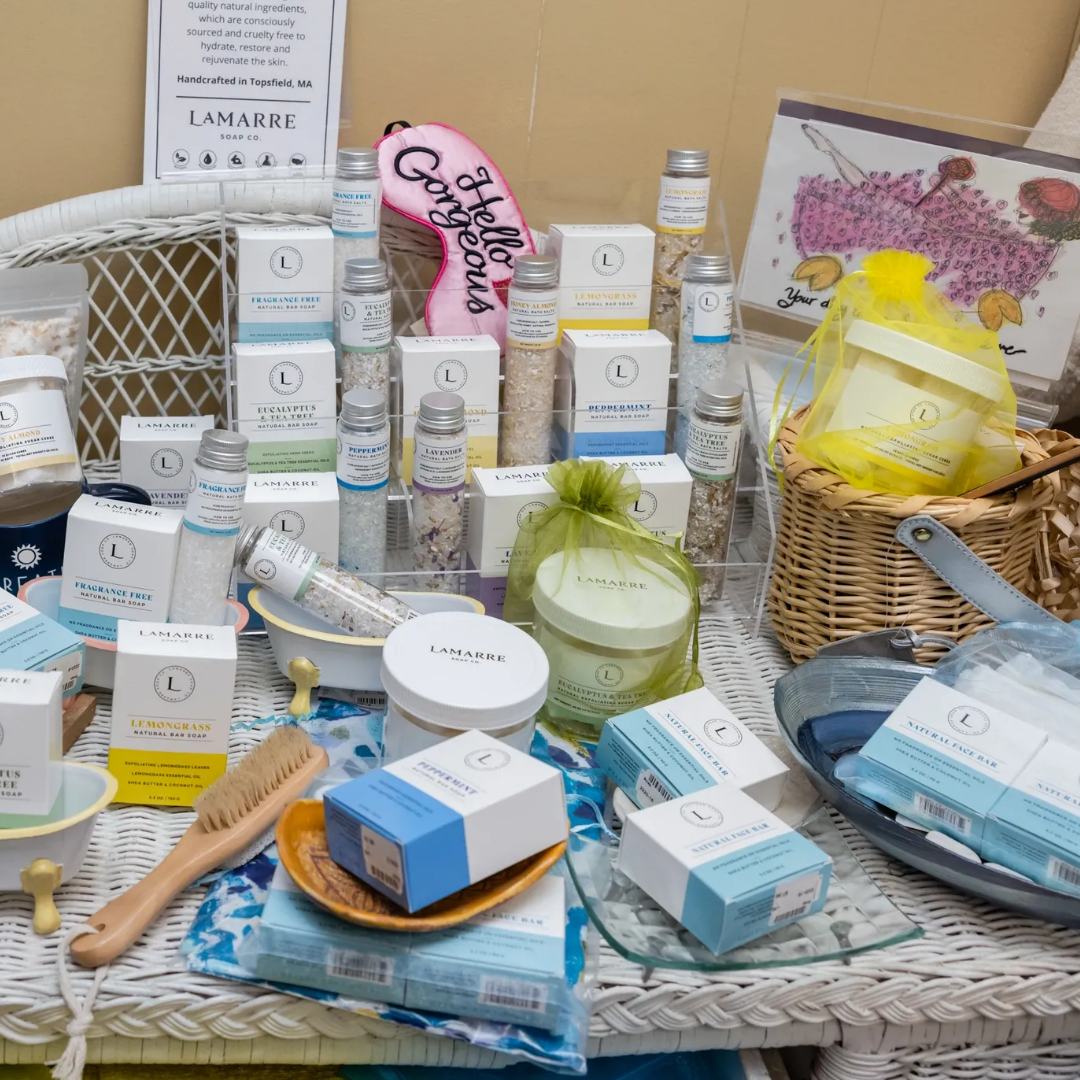 a table filled with lots of boxes and bottles of cosmetics