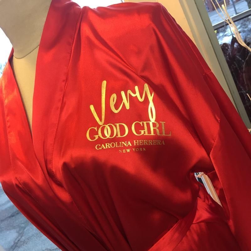 a red robe that says very good girl on it