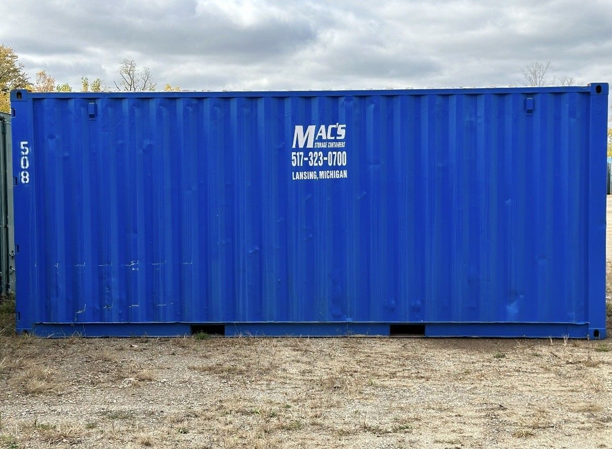 Blue waste container on a truck.