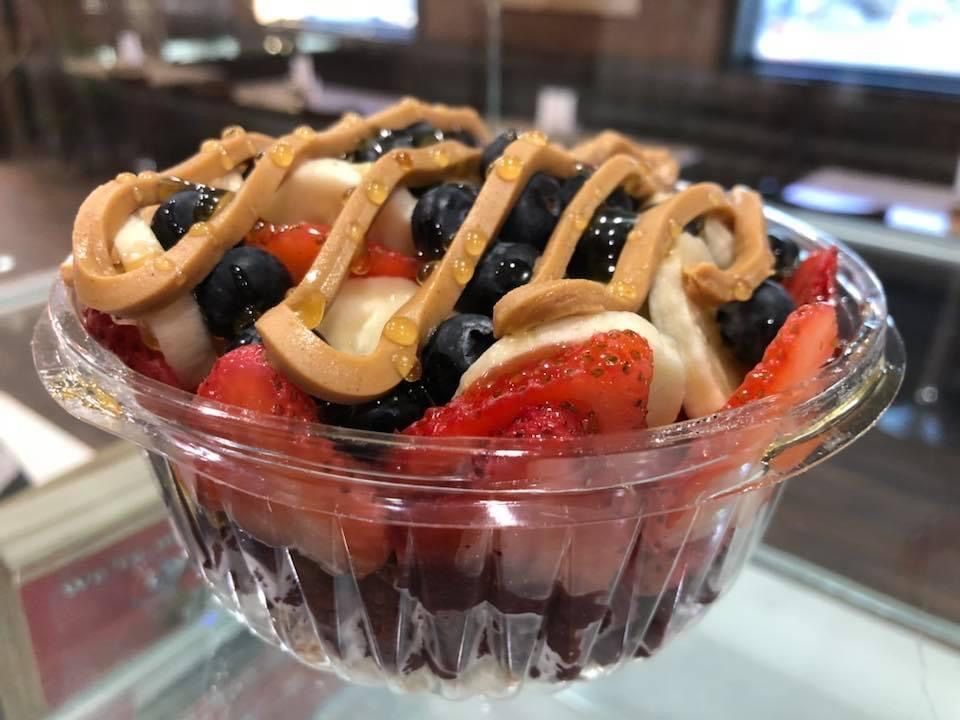 caramel, banana, strawberry and blueberry bowl