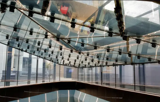 A building with a lot of windows and a glass ceiling.