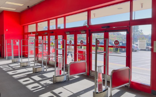 The inside of a target store with a lot of red doors.