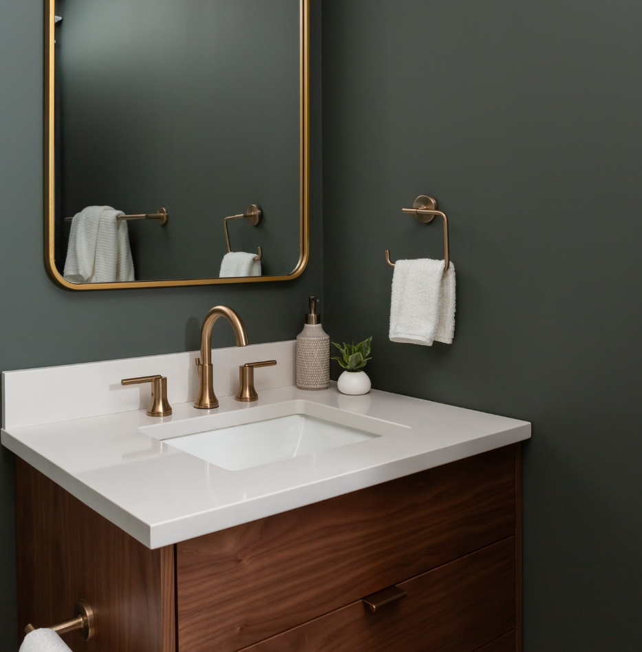 A bathroom with a sink and a mirror on the wall