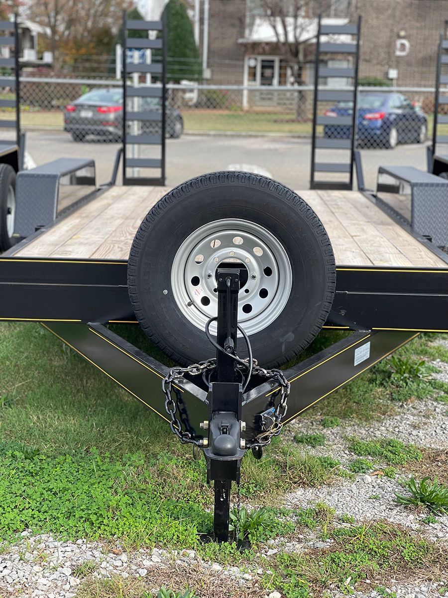 Equipment trailer with spare wheel
