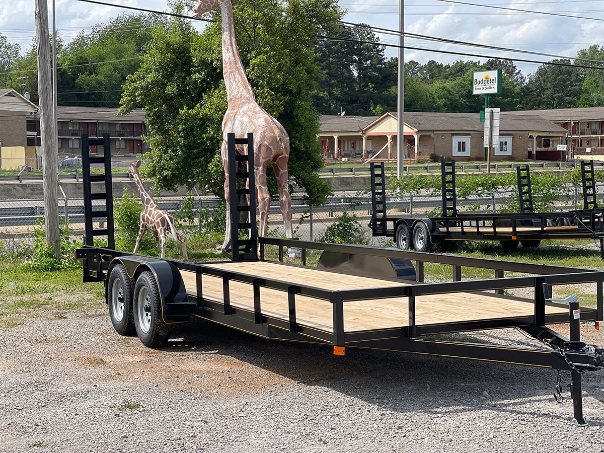 Tandem trailer with stand up ramp