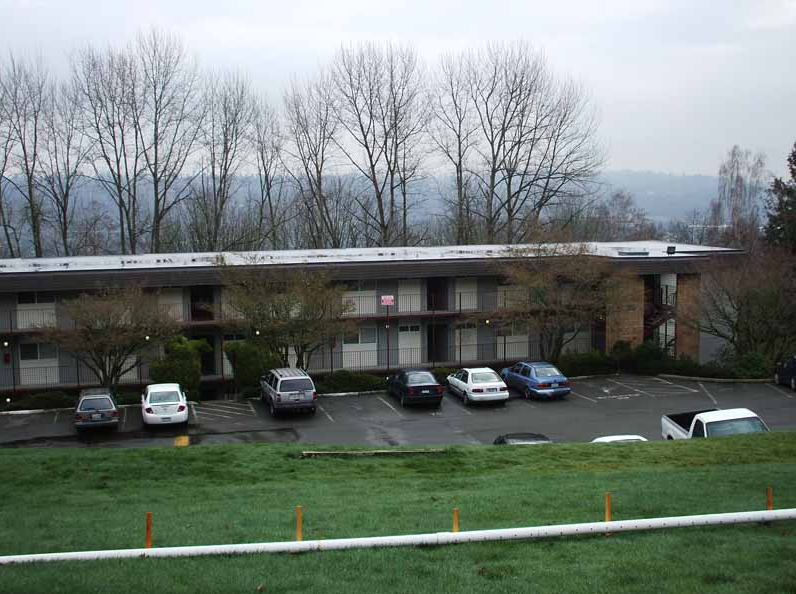 A building with a lot of cars parked in front of it