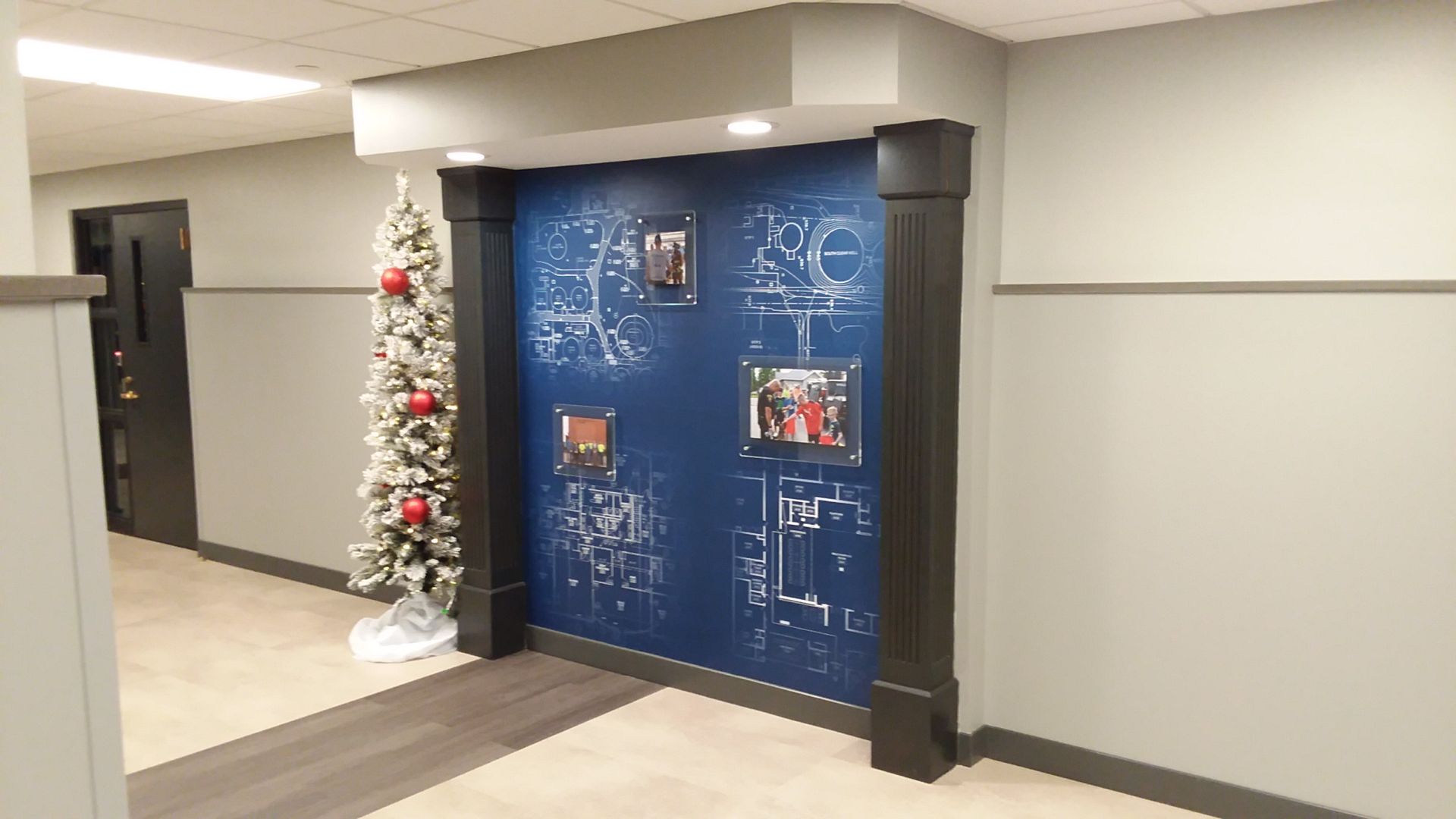 A hotel room with a king size bed , couch , desk and television.