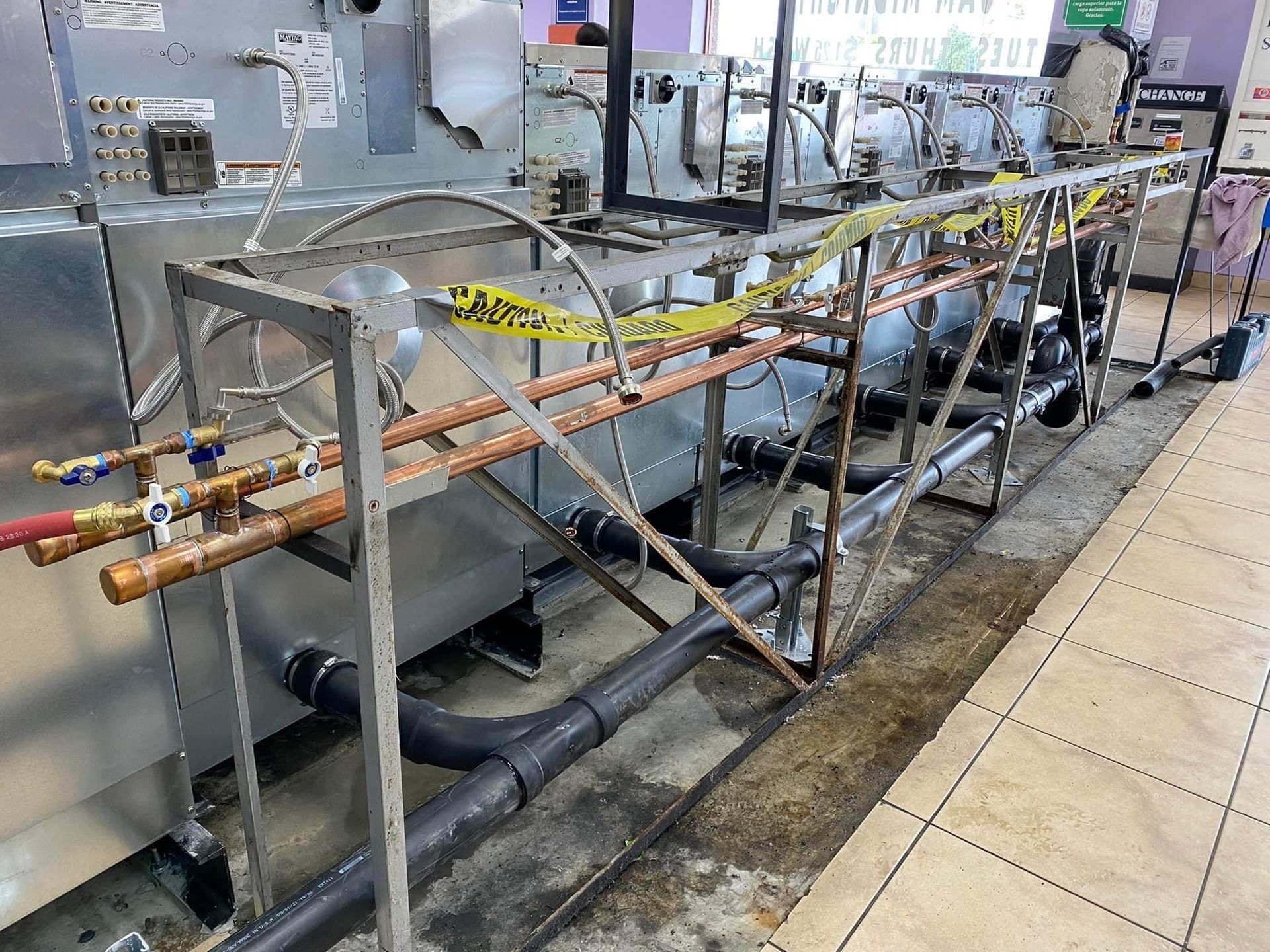 A row of pipes are lined up in a room.
