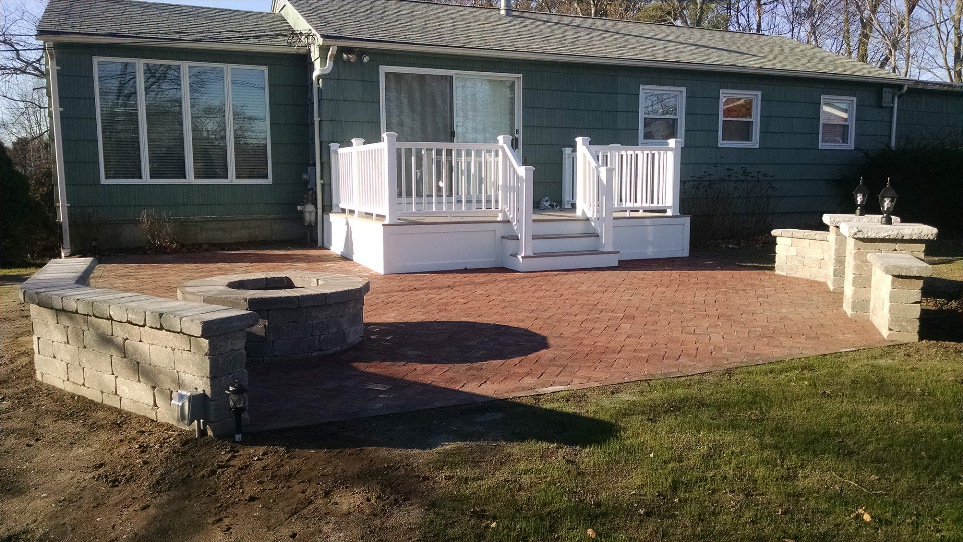 A house with a fire pit in front of it