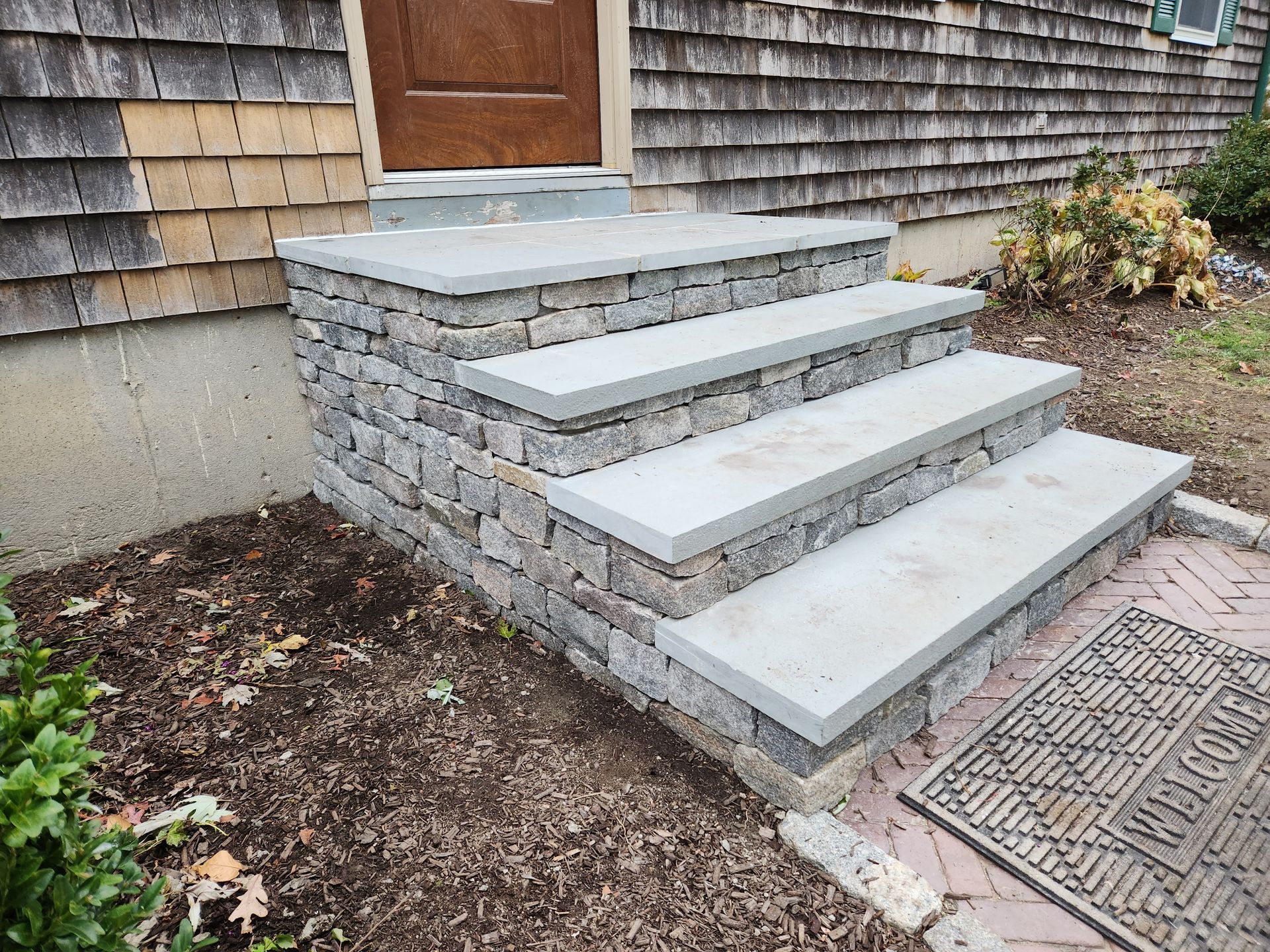 A set of stone steps leading up to a house