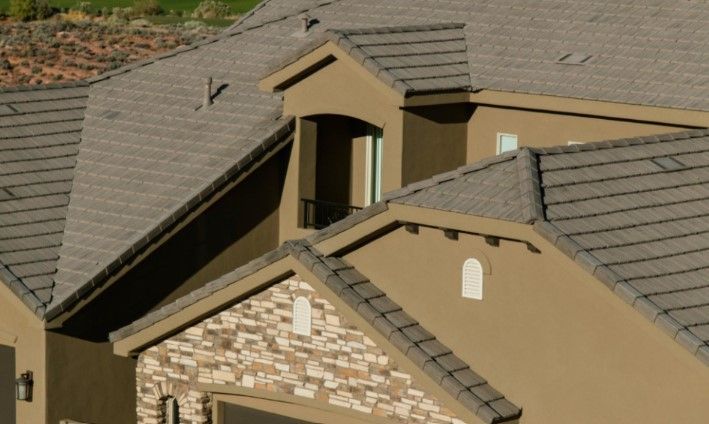 A house with a roof that has shingles on it