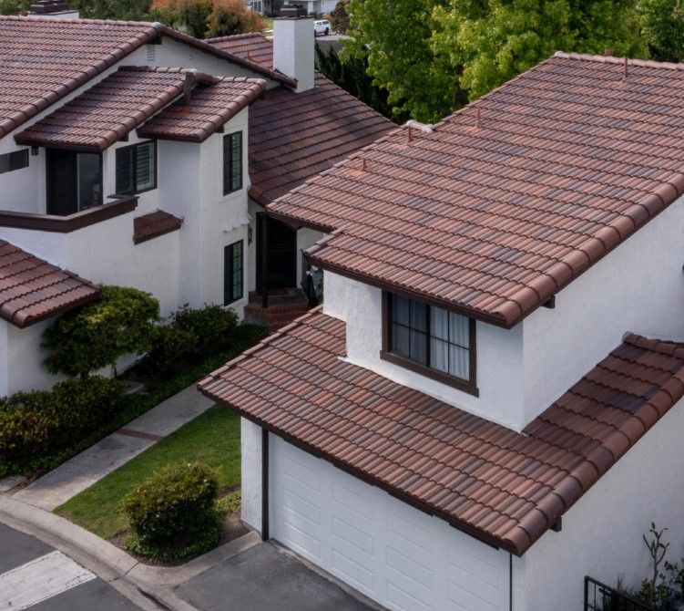 A white house with a brown tile roof