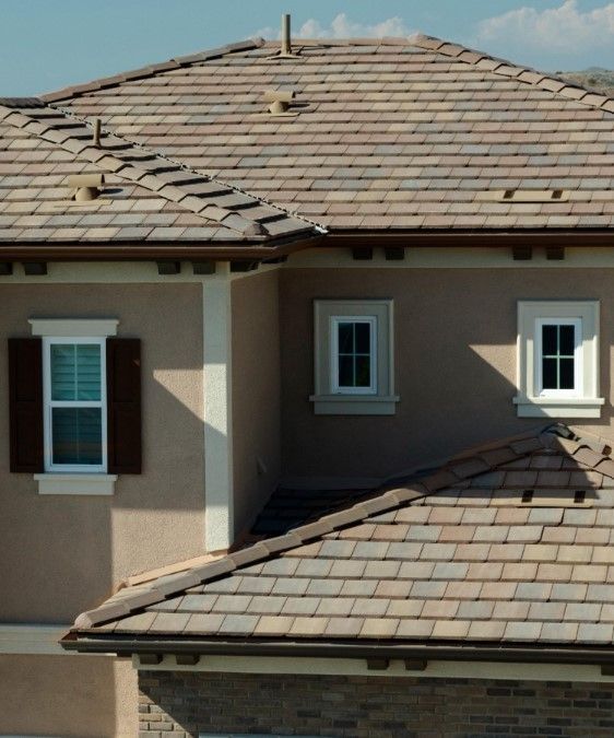 A house with a tiled roof and two windows