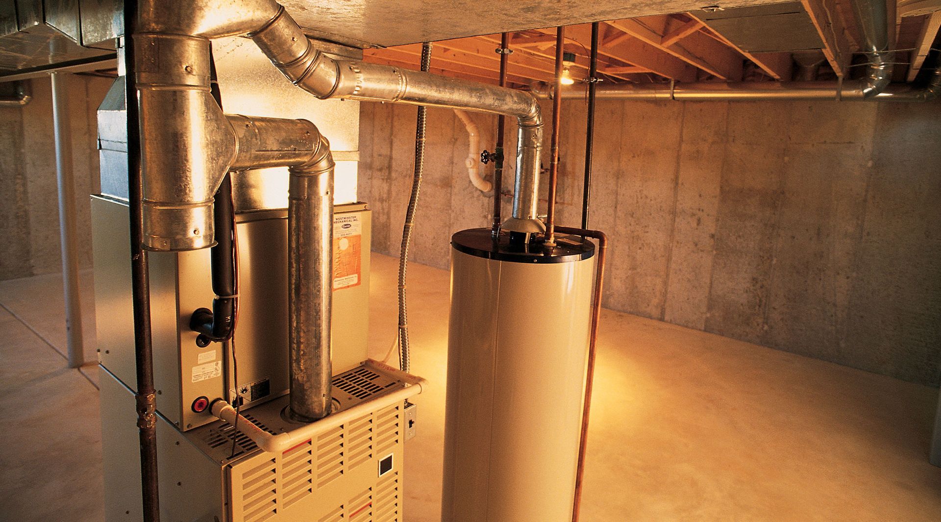 A basement with a furnace and a water heater