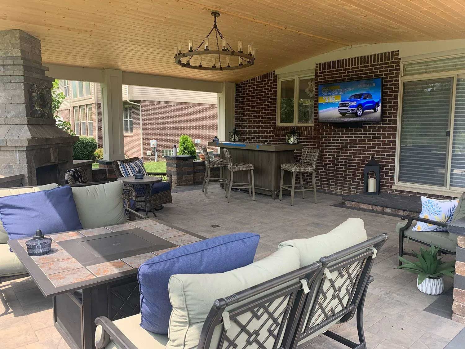 Aerial view of a river winding through a dense green forest.