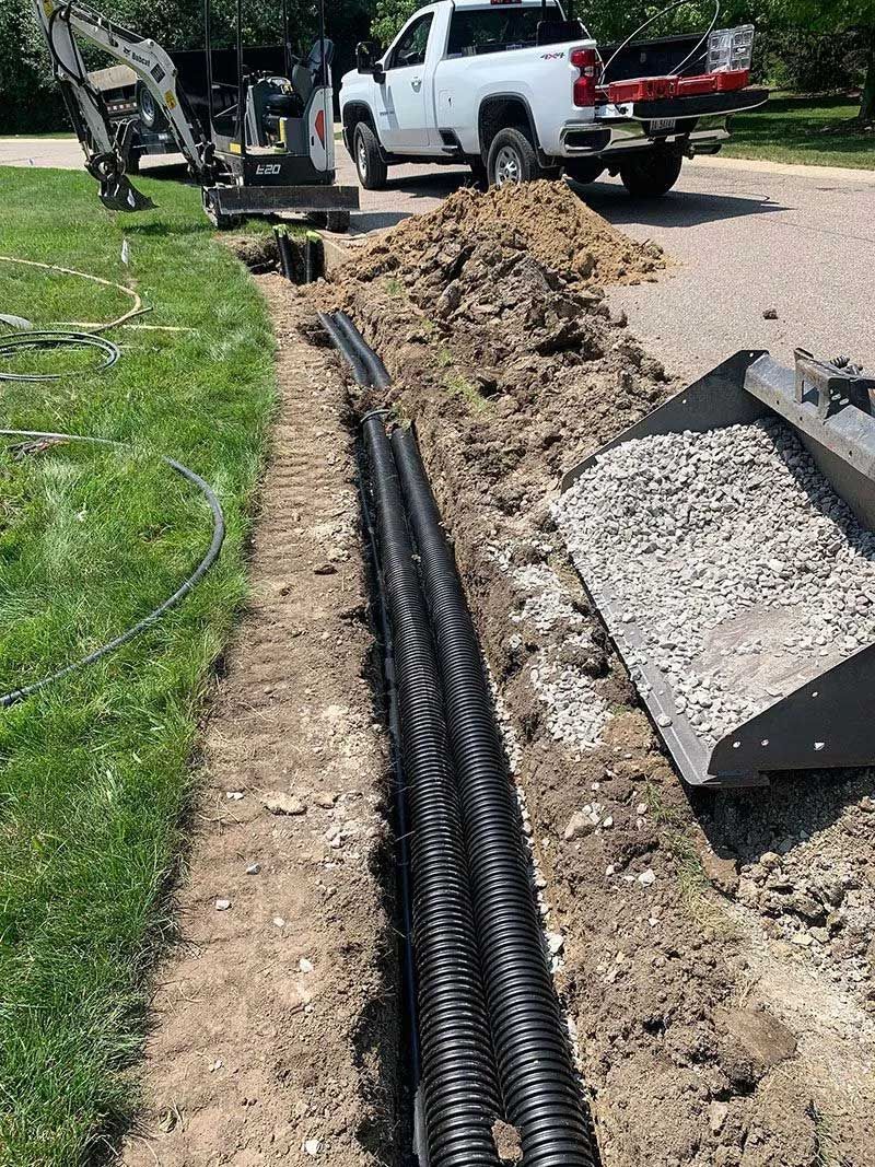 Sandy surface with curved ridges and shadows.