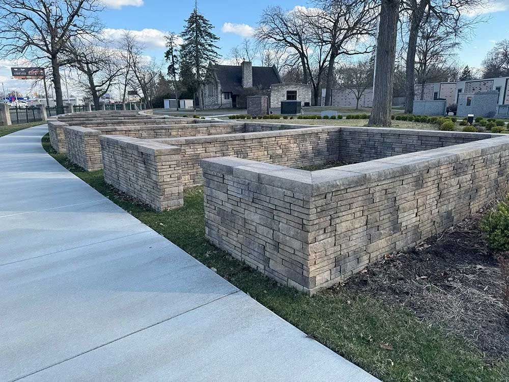 Aerial view of a lush green forest with a winding blue river running through it.