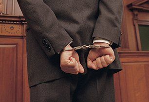 Handcuffed man in the court room