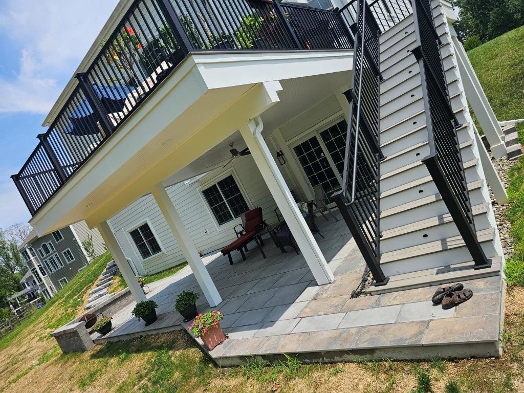 There is a large deck with stairs leading up to it.