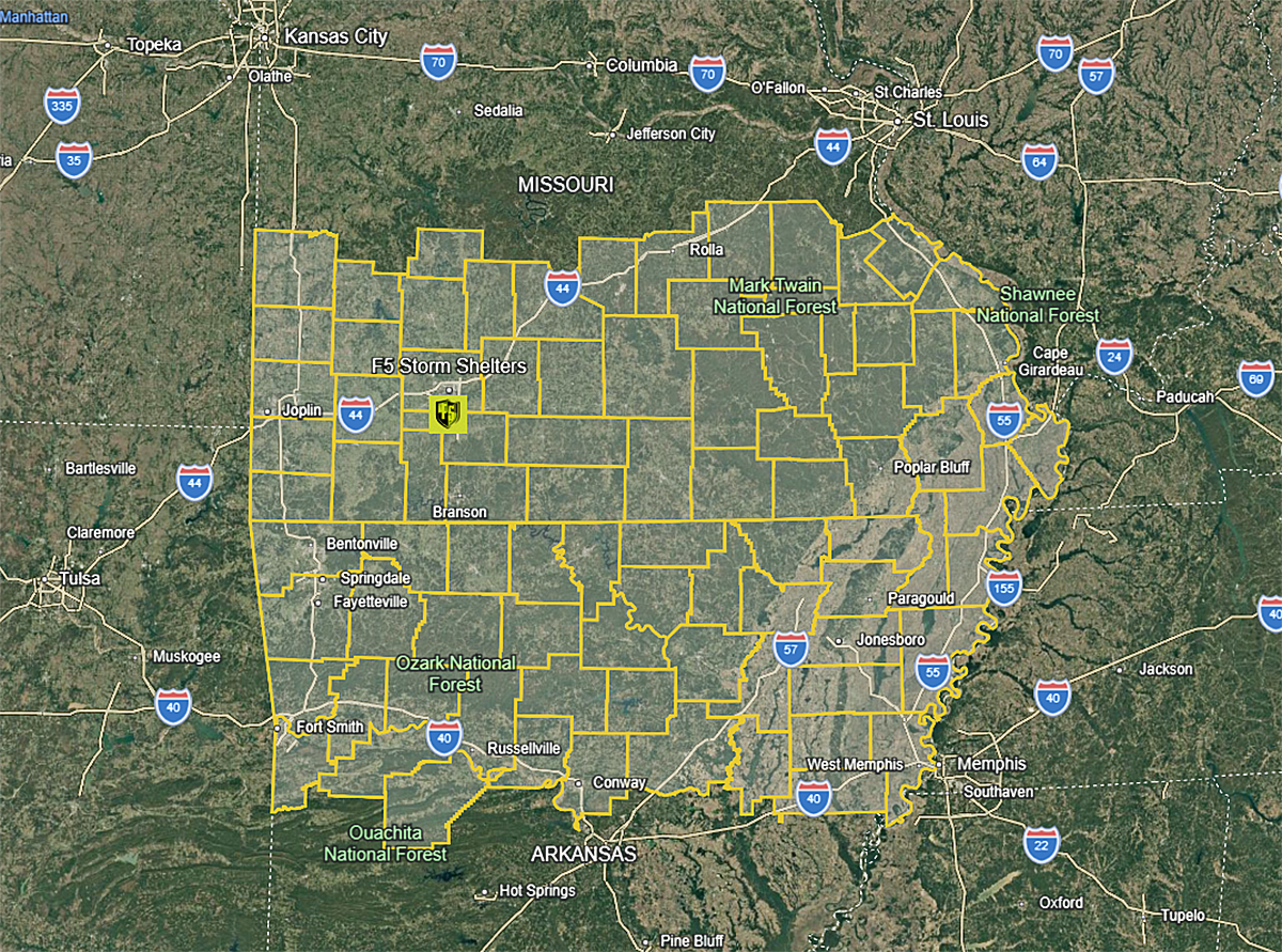 Satellite map with yellow outlined boundaries over a city and surrounding roads