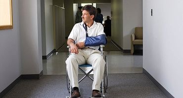 Injured man in a wheel chair