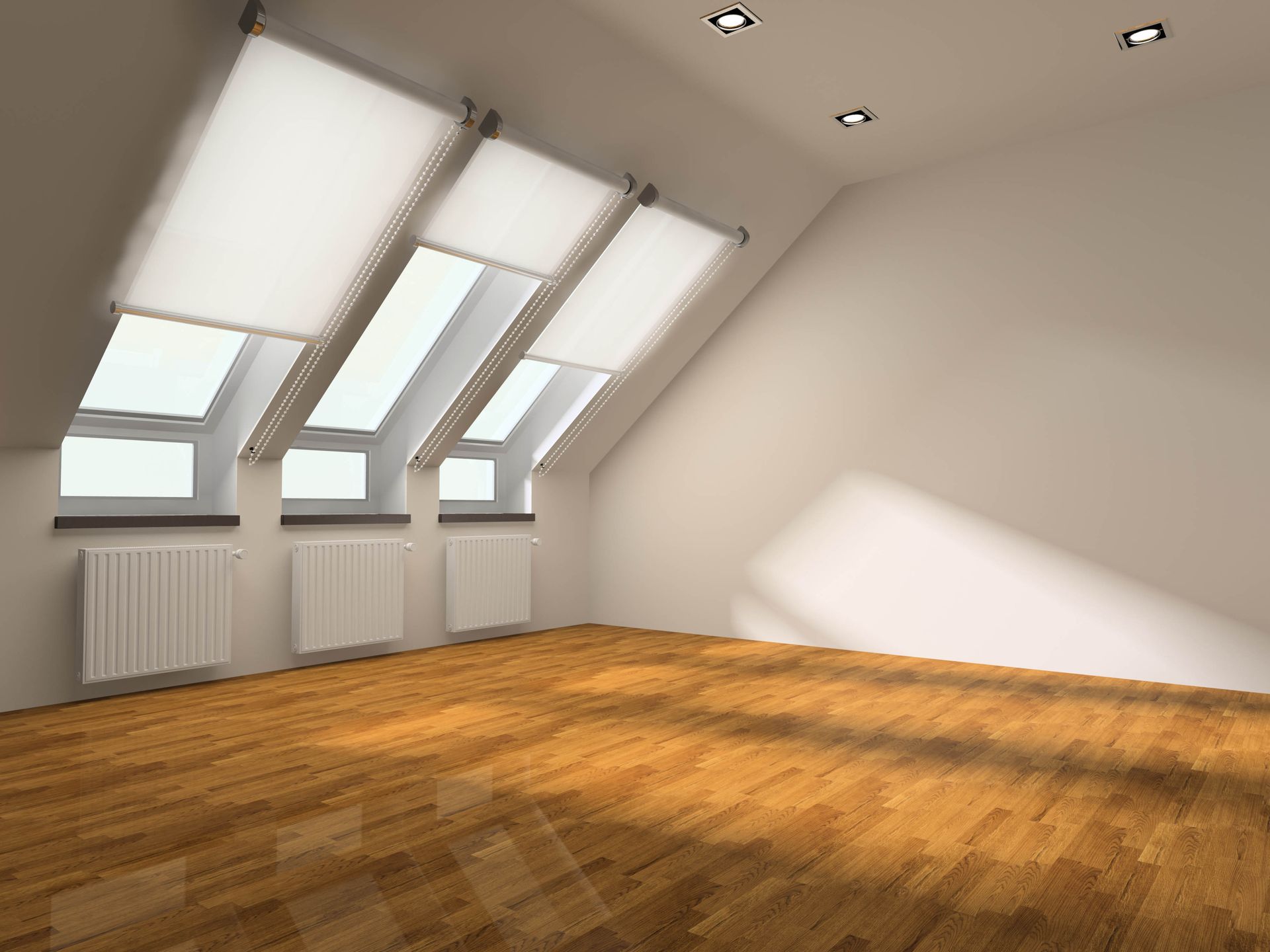 An empty attic room with sloped ceiling, skylight windows, hardwood floor, and radiators.
