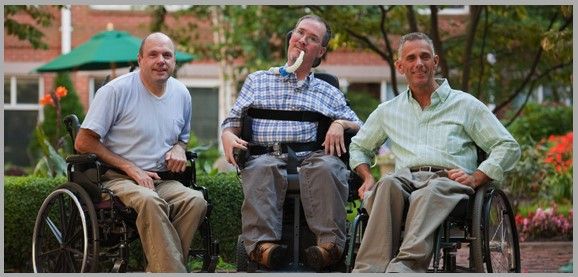 Three men on wheelchairs
