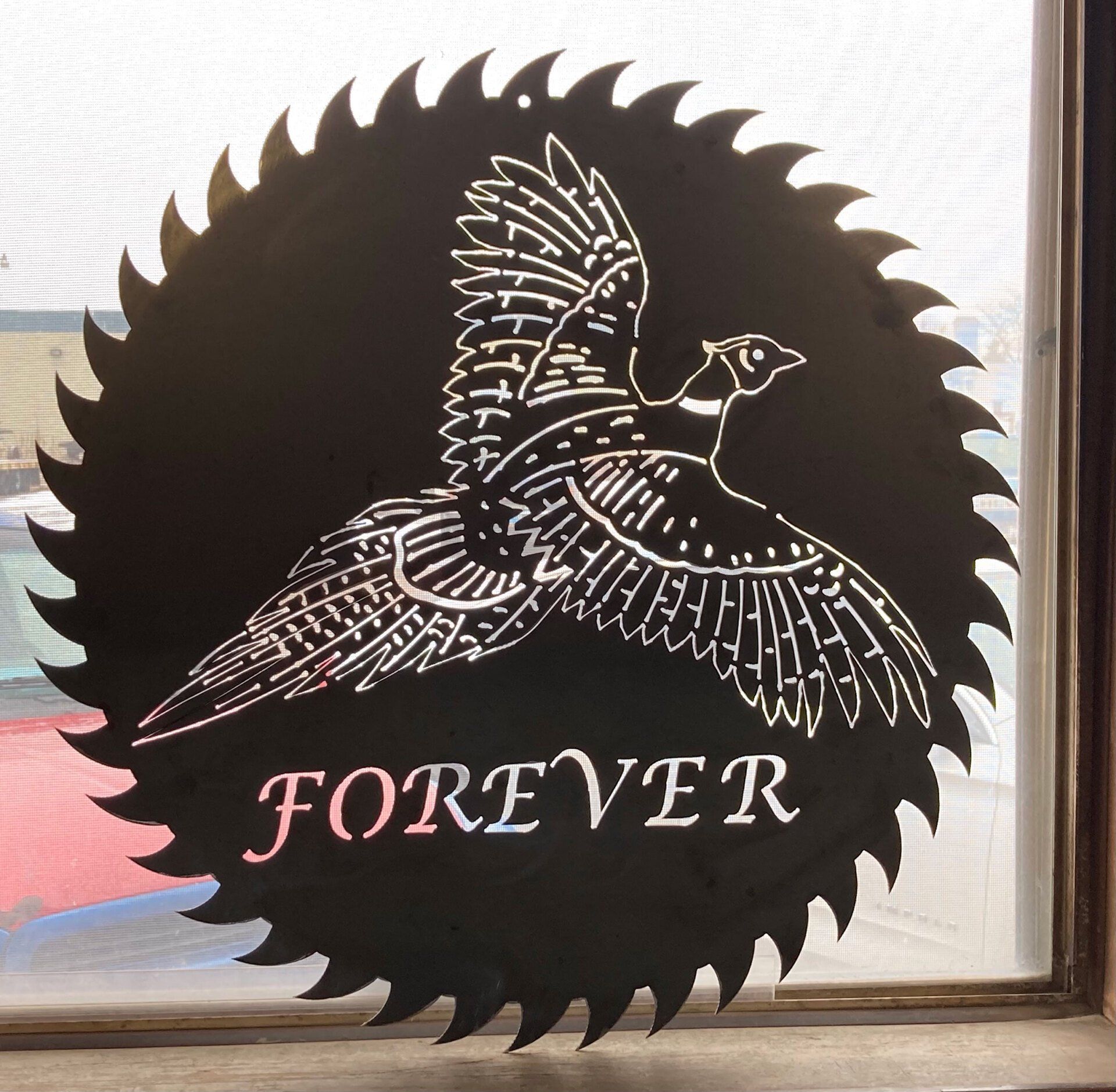 A sign that says forever with a pheasant on it