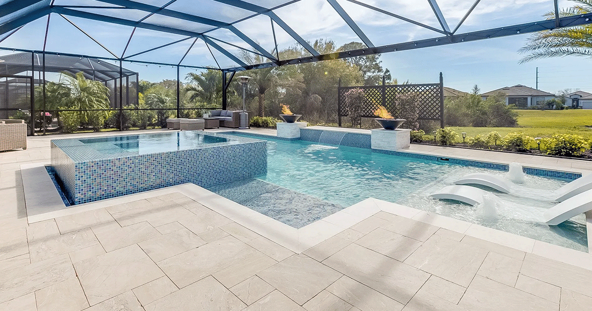 There is a large swimming pool in the backyard of a house.