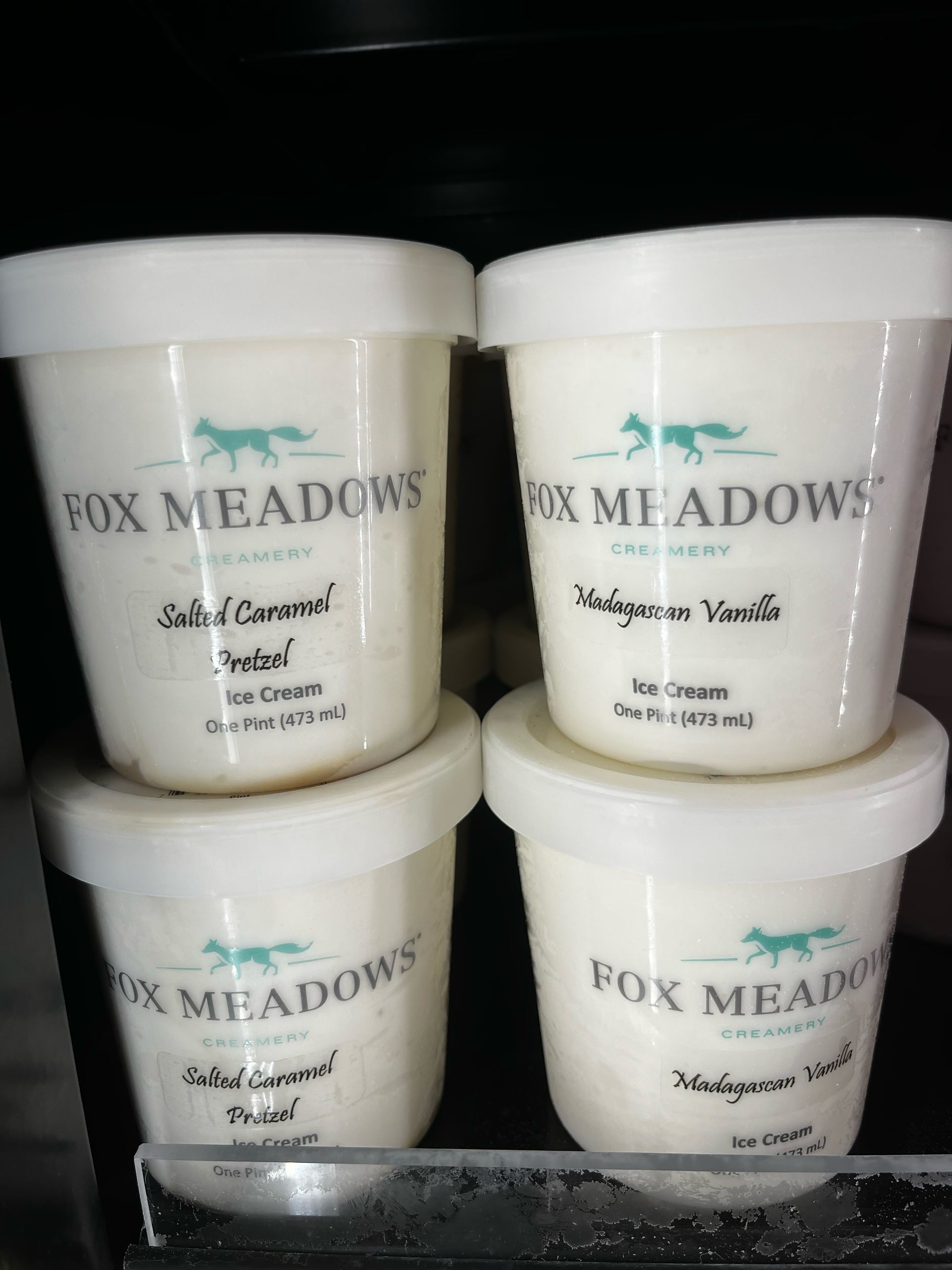 4 white Fox Meadows Creamery pints of ice cream