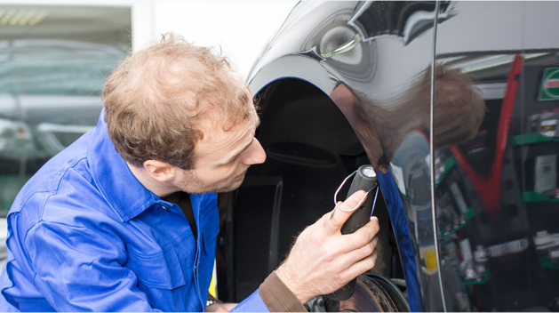 Mechanic inspecting the car