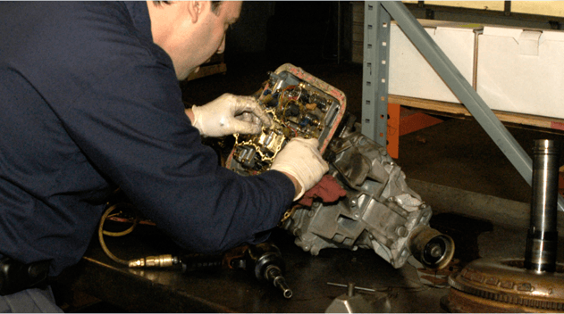Mechanic repairing transmission