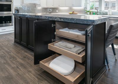 A kitchen with a large island and lots of drawers