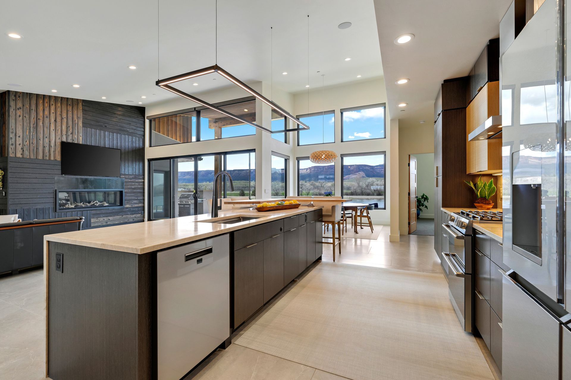 A large kitchen with stainless steel appliances and a large island