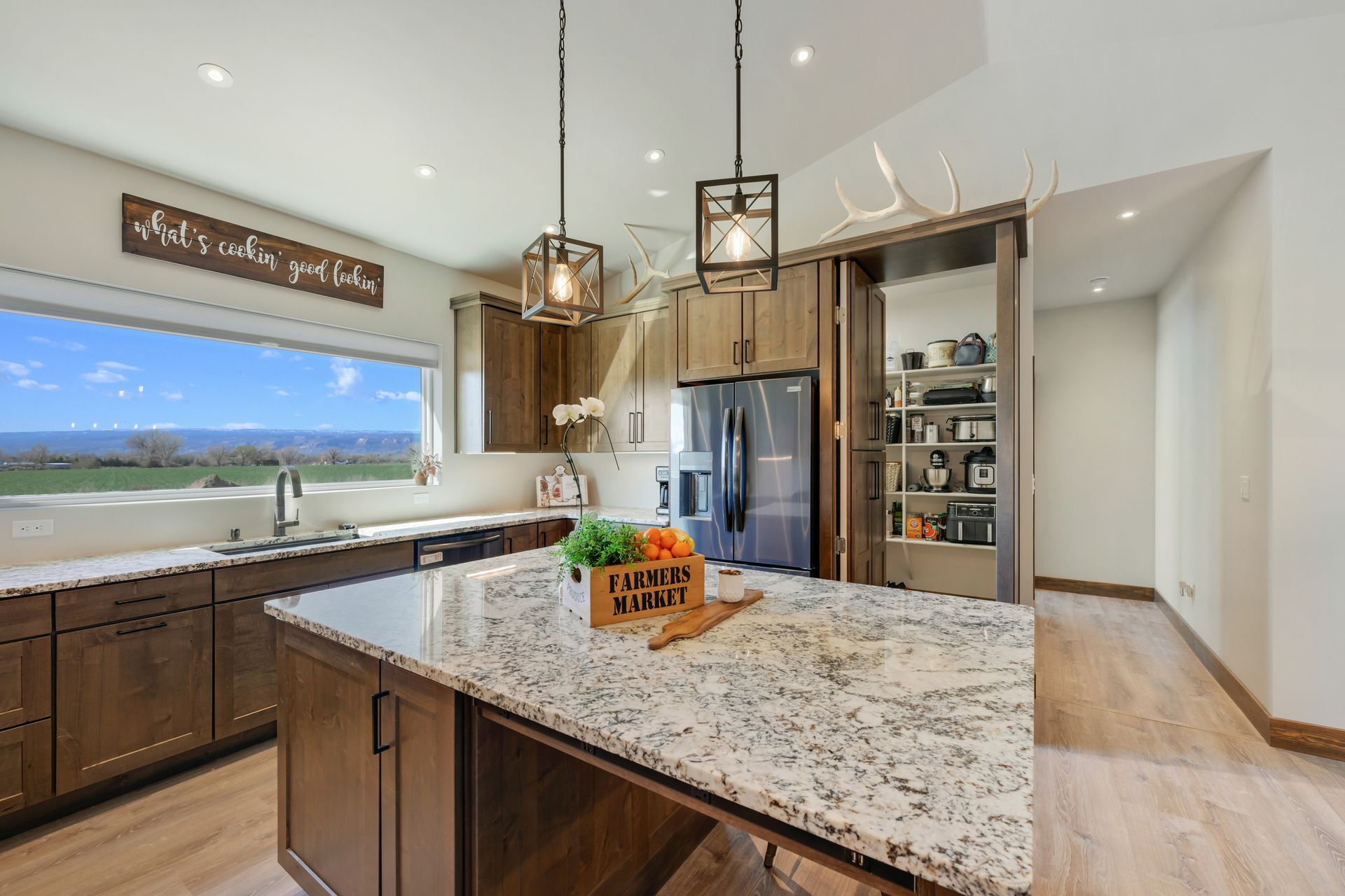 a kitchen with granite counter tops and a large island .