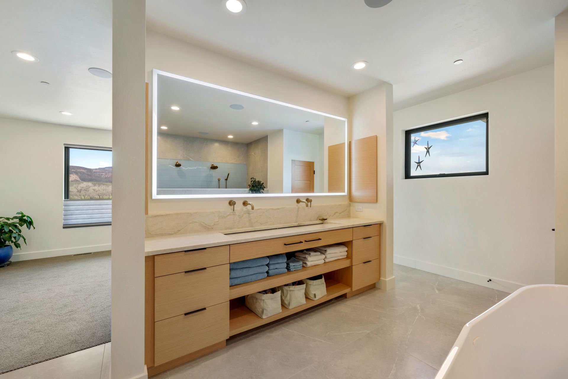a bathroom with two sinks and a large mirror .