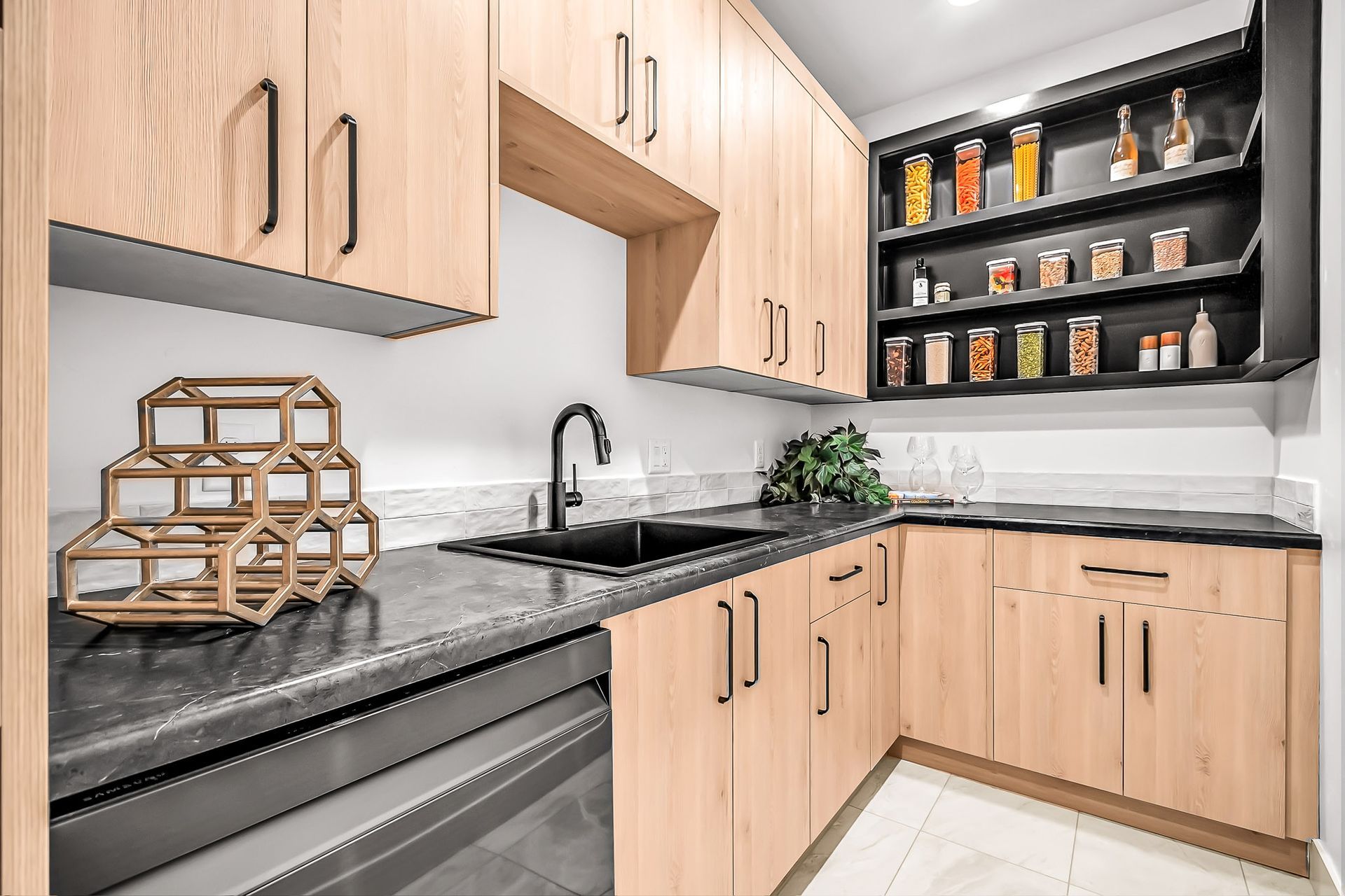 a kitchen with wooden cabinets and stainless steel appliances