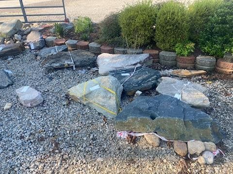 a pile of rocks sitting on top of gravel