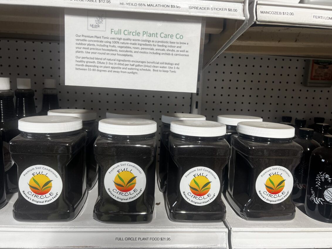 a shelf filled with jars of food with labels on them