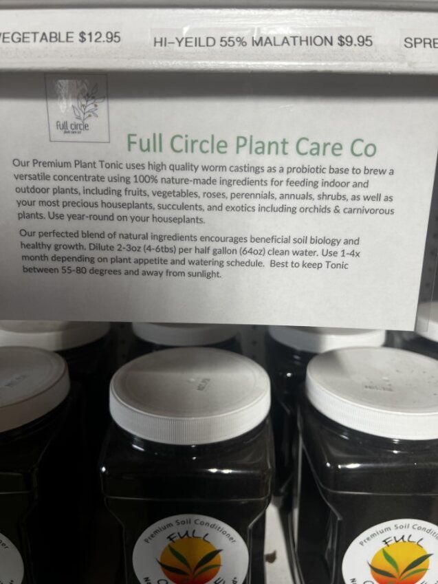 bottles of full circle plant care co are lined up on a shelf
