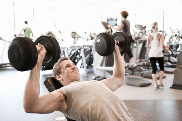 Man exercising with dumbbells