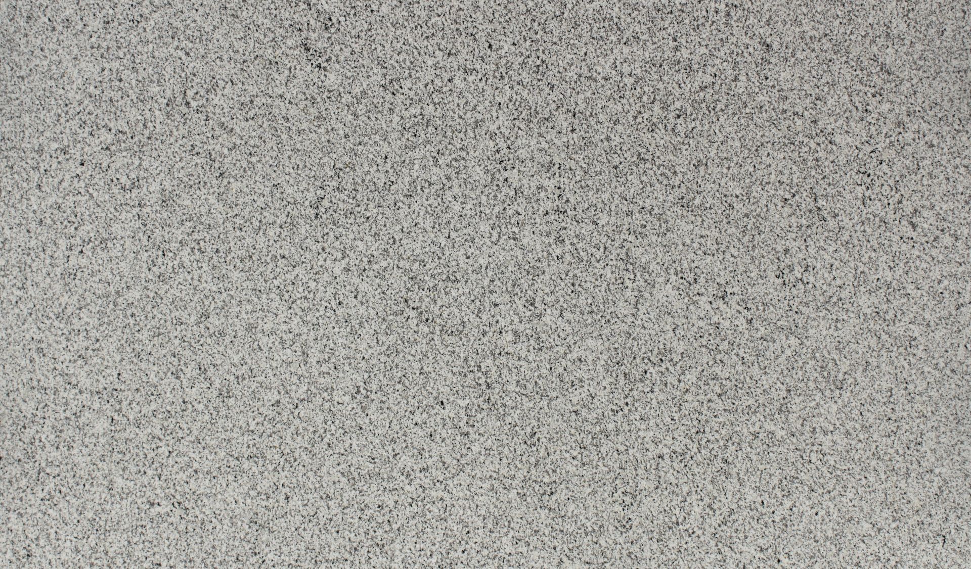 Gray speckled textured surface with a fine grain pattern
