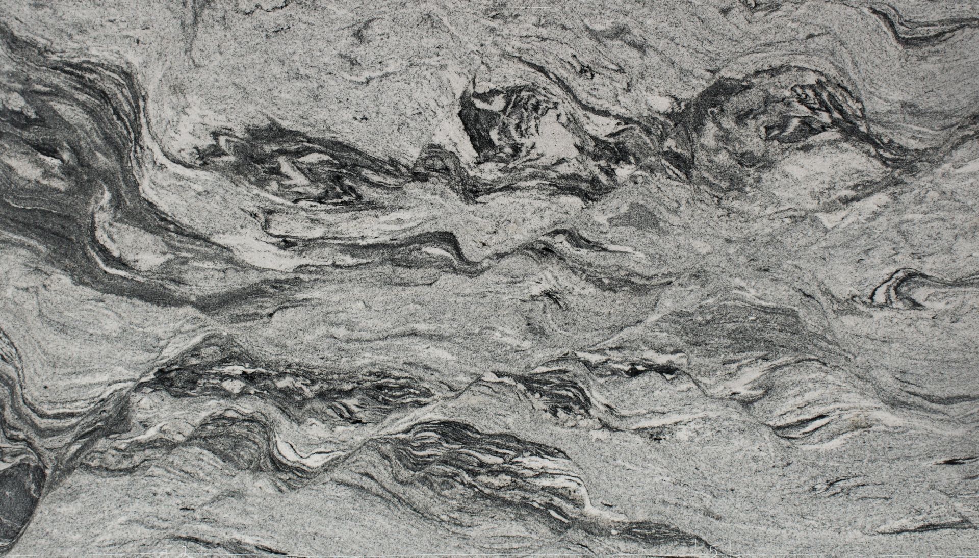 Gray marbled stone surface with swirling black and white veining