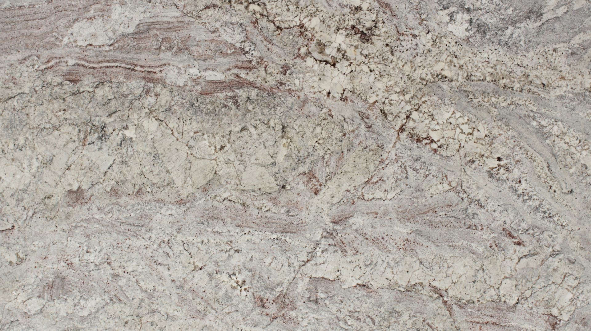 Close-up of light beige and gray stone or marble surface with subtle reddish veins